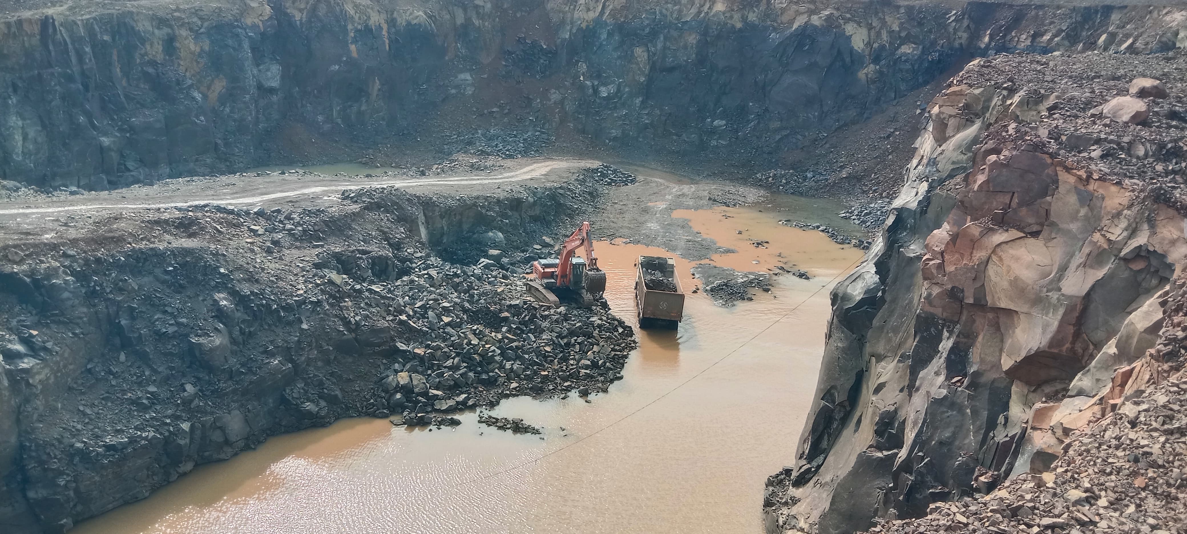 Quarry face prepared for blasting